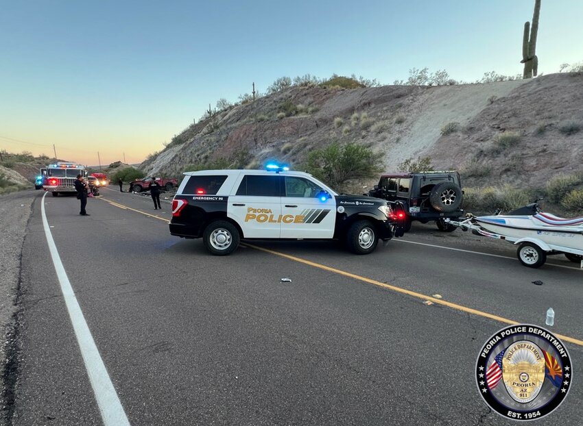 Two people died Saturday in a two-vehicle collision near Lake Pleasant in Peoria.