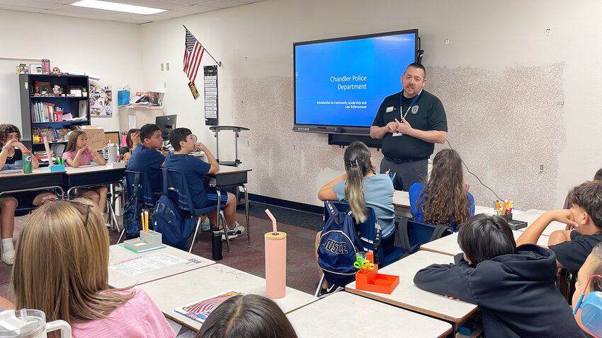 A Chandler Unified School District elementary school class hears a presentation from the Chandler Police Department. A new program, funded by the city of Chandler, will allow seasoned officers to teach students about leadership, respect, substance abuse, and cyber-dilemmas.