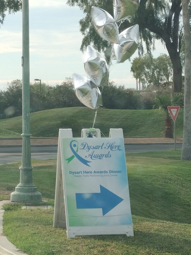 Dysart Hero Awards signs along the road directing attendees to the Happy Trails Performing Arts Center in Surprise.