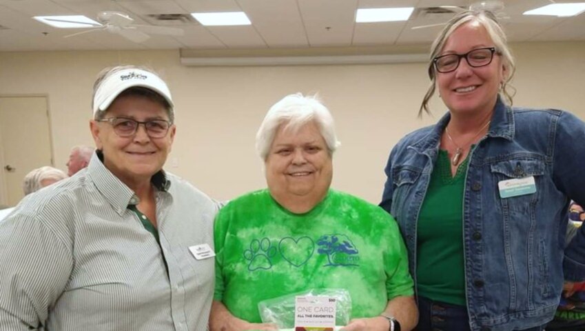 Pictured are LGBT club president Susie Broussard, Marsha Rory and program manager Renee Sanderson, of My Home Group.
