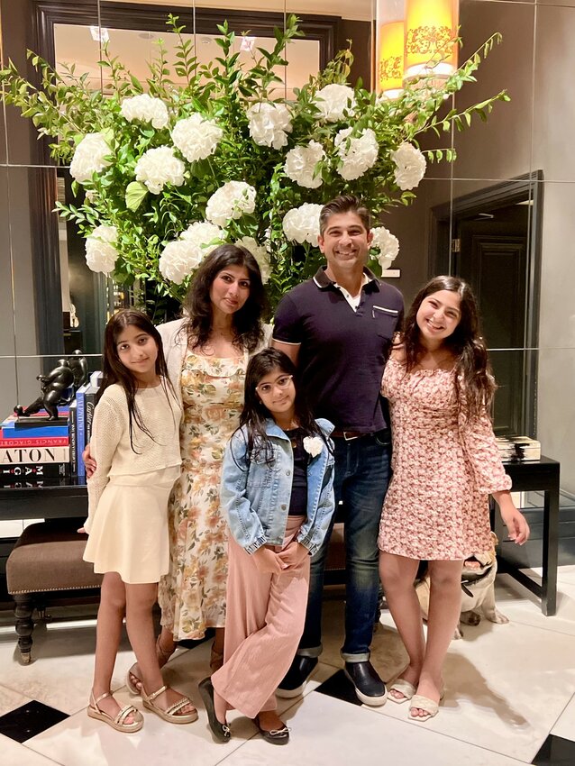 Nooraly &ldquo;Aly&rdquo; Lalji is pictured with his wife Sara and three daughters now aged eight, 10 and 14.
