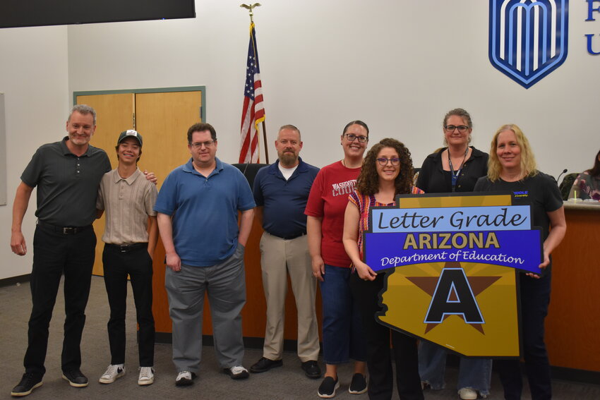 Fountain Hills High School was awarded an &ldquo;A&rdquo; letter grade from the Department of Education, and several members of the high school staff and student body received a sign to celebrate their accomplishments at the April 17 board meeting. (Independent Newsmedia/George Zeliff)