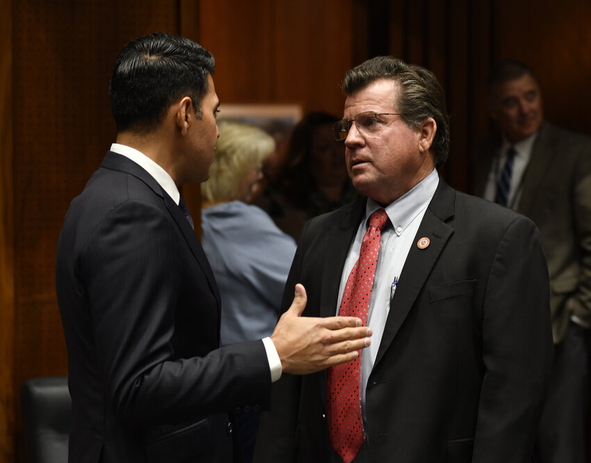Rep. Tim Dunn, right, chats with Rep. Steve Montenegro ahead of the House considering the repeal of an 1864 abortion law. (Capitol Media Services/Howard Fischer)