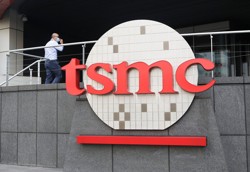 A person walks into the Taiwan Semiconductor Manufacturing Co., Ltd. (TSMC) headquarters in Hsinchu, Taiwan. TSMC announced it has begun the manufacturing process of making microchips in Arizona, according to a TSMC spokesperson.