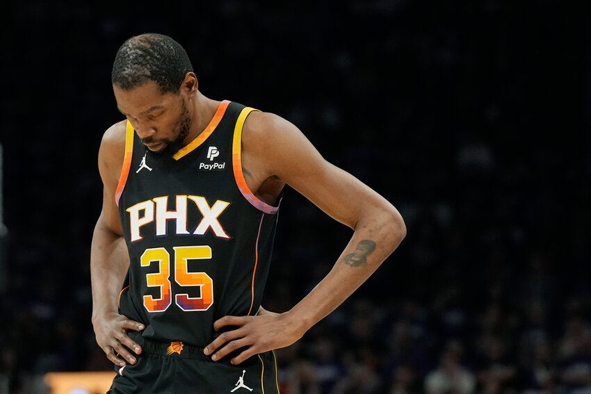 Suns forward Kevin Durant pauses on the court during the first half of Game 4 of a first-round playoff series against the Minnesota Timberwolves, Sunday in Phoenix. The Timberwolves won 122-116, taking the series 4-0. (The Associated Press/Ross D. Franklin)