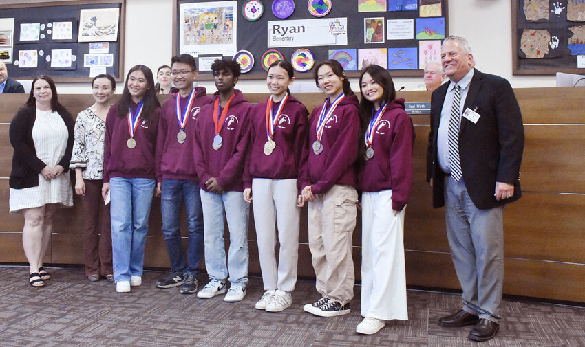 Hamilton High School&rsquo;s Academic Decathlon team recently wrapped up another state championship and was honored at a Chandler Unified School District Governing Board meeting. On the far left is assistant coach Esther Bateson. Team members include Chloe Zhan, Andy Ma, Claire Zhan, Audrey Zhang, Srijay Kalavena, Arun Chebrolu, Bruce Shen, Thi Nguyen and Taryn Preis. On the far right is CUSD Superintendent Frank Narducci.