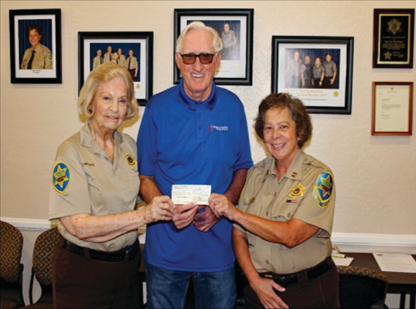 Pictured are Lt. Fran McElroy, executive officer of operations, Terry Hamman, chair of the Planned Giving and Endowment Committee, and Capt. Carolyn Patterson, commander of the SCW Posse.