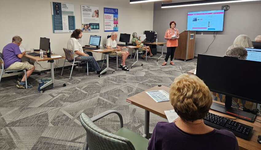 Jackie Cromer, instructor of the online dating class, helps seniors from the Sun Cities  work through online dating in a safe manner.