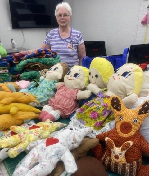 Marian Clish is surrounded by some of the items Sewing from the Heart made for the Phoenix Indian Medical Center. Sewing from the Heart is a special interest group within the Rip &rsquo;N&rsquo; Sew club of Sun City West.