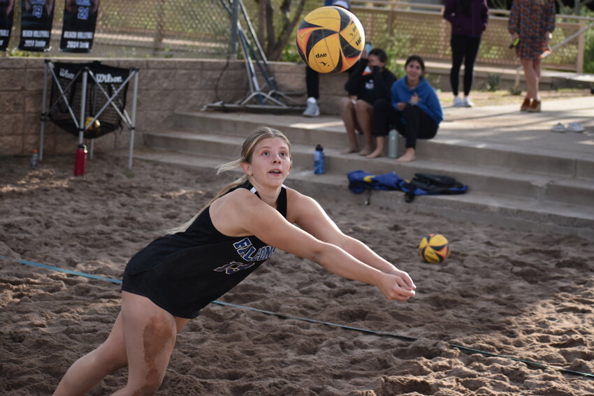 Senior Sydney Boeshans keeps her eyes on the ball as she dives to get under it. (Independent Newsmedia/George Zeliff)