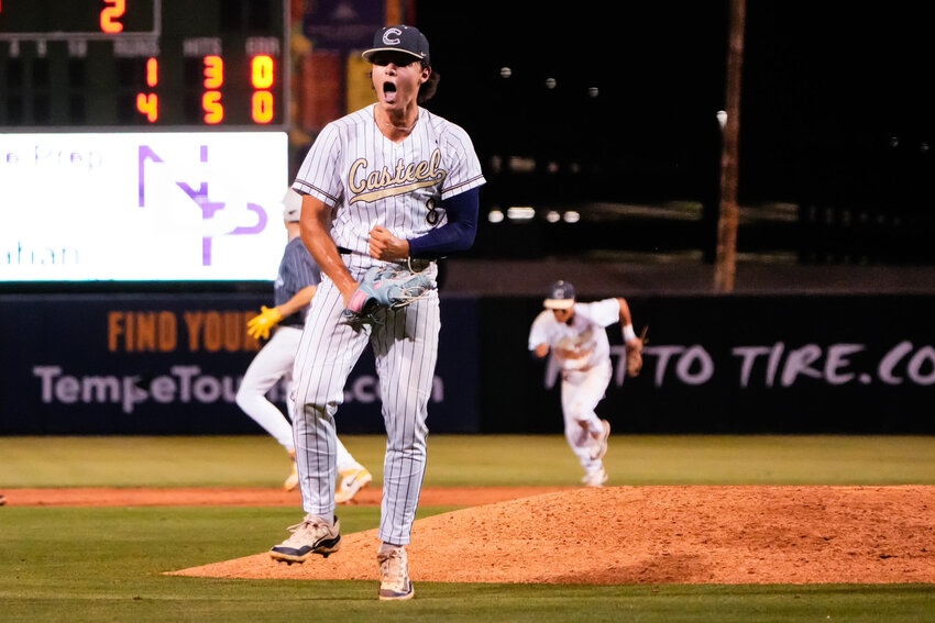 Casteel senior Mason Russell pumps up the dugout after closing out an inning. (Arianna Grainey/Casteel Athletics)