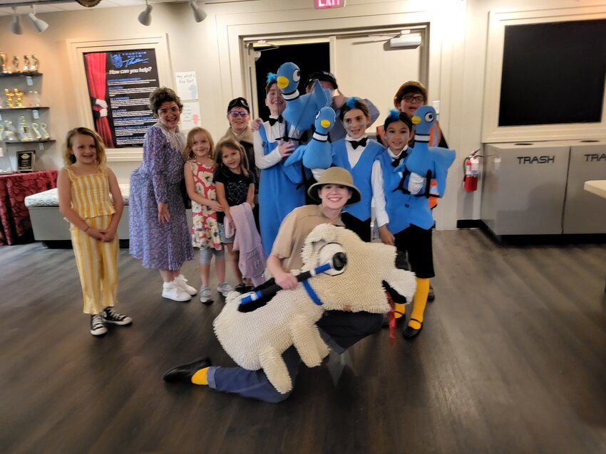 Sunset Kiwanis organized 15 elementary school children to see Fountain Hills Youth Theater&rsquo;s production of, &ldquo;Don&rsquo;t Let the Pigeon Drive the Bus: The Musical.&rdquo; The children enjoyed the musical which was full of songs and laughter. Some of the children stayed to take a picture with the cast.