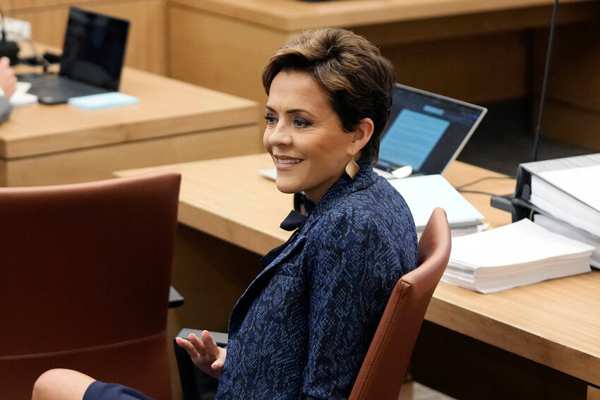 Former Arizona Republican governor candidate Kari Lake sits in court at Maricopa County Superior Court during a voting records trial Thursday, Sept. 21, 2023, in Phoenix. (AP Photo/Ross D. Franklin, Pool)
