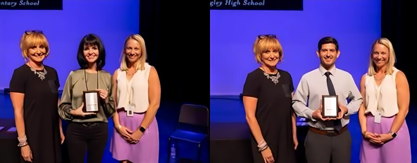 Adrienne Raleigh and David Nuttall receive their awards as the Higley Unified School District's teachers of the year from interim Superintendent Sherry Richards, left, and Elementary Education Executive Director Heidi Lindsay, right.