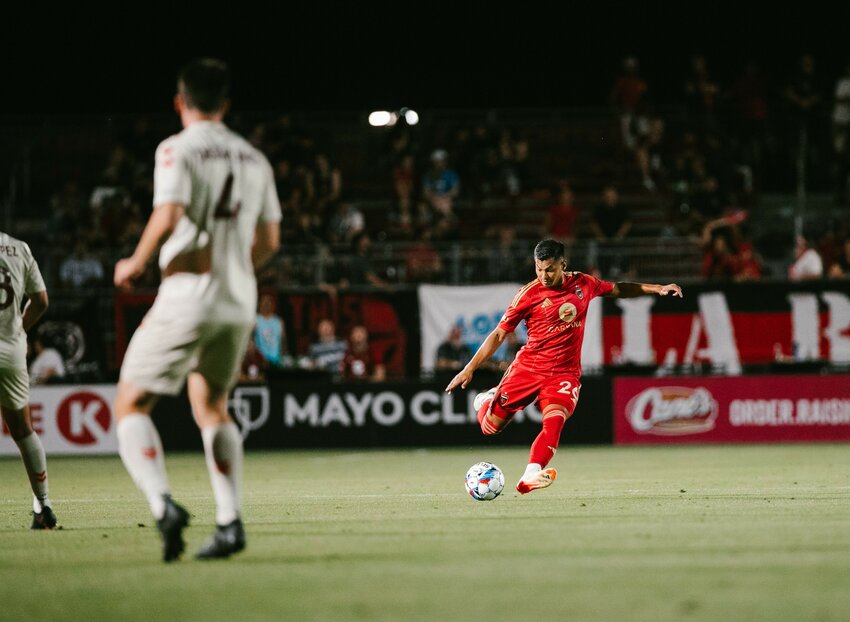 Rising's Renzo Zambrano kicks the ball down the pitch against Sacramento on Saturday night. The match ended in a 1-1 draw. (Phoenix Rising FC)