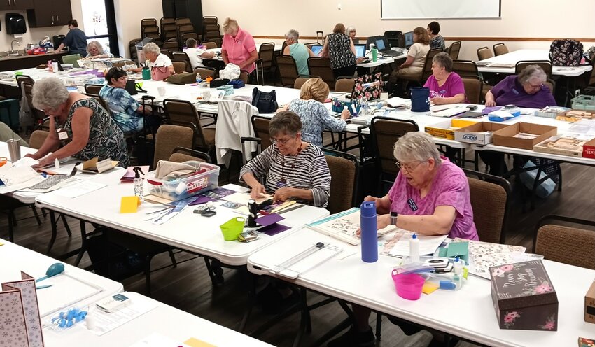 In recognition of National Scrapbooking Day, members of SPAM work on traditional and digital scrapbooks, handcraft greeting cards and make one-of-a-kind memory books.