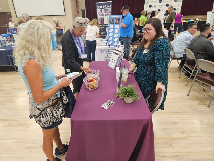 Alicia Sunada, of Home Instead, talks with guests of the Sun City Senior Expo May 6 at Sundial Recreation Center.