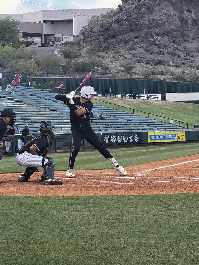 Mountain Ridge senior Brady Plecity prepres to swing at a pitch by Queen Creek during a 6A baseball playoff winners bracket semifinal May 4 at Tempe Diablo Stadium.