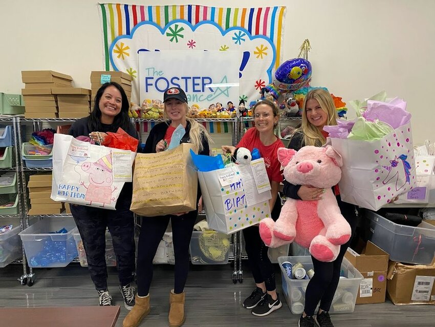 The Foster Alliance has volunteers working on Birthday Bags for children.