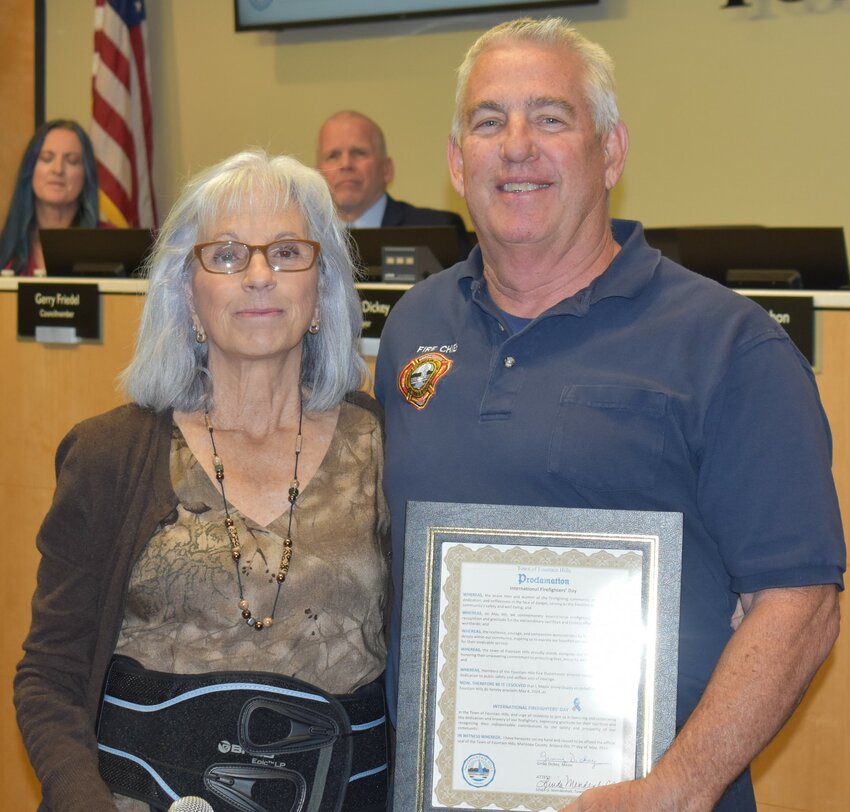 Fountain Hills Fire Department Chief Dave Ott accepts the International Firefighters&rsquo; Day proclamation from Mayor Ginny Dickey.