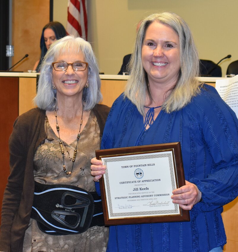 Mayor Ginny Dickey, left, presents Jill Keefe with a certificate of appreciation for her service to the town as a member of the Strategic Planning Advisory Commission.