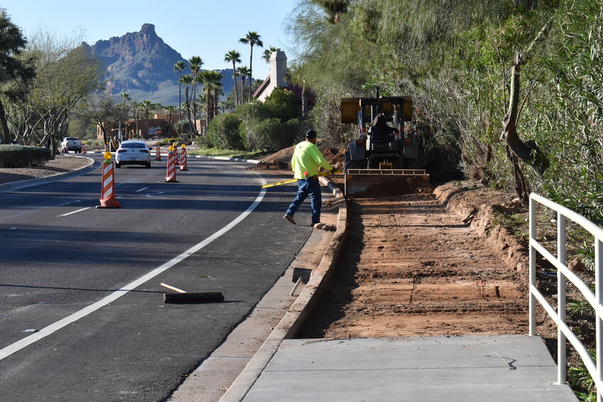 Sidewalk construction along Saguaro Boulevard near Kingstree Boulevard.