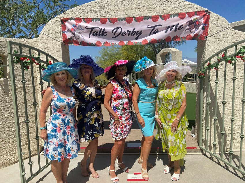 PEO members celebrated the Kentucky Derby with a fundraiser for women&rsquo;s scholarships. Standing, from left, are PEO members Susan Slapke, Pam Reinmuth, Kathy Dietz, Vicki Martin and Kathy Rubin.