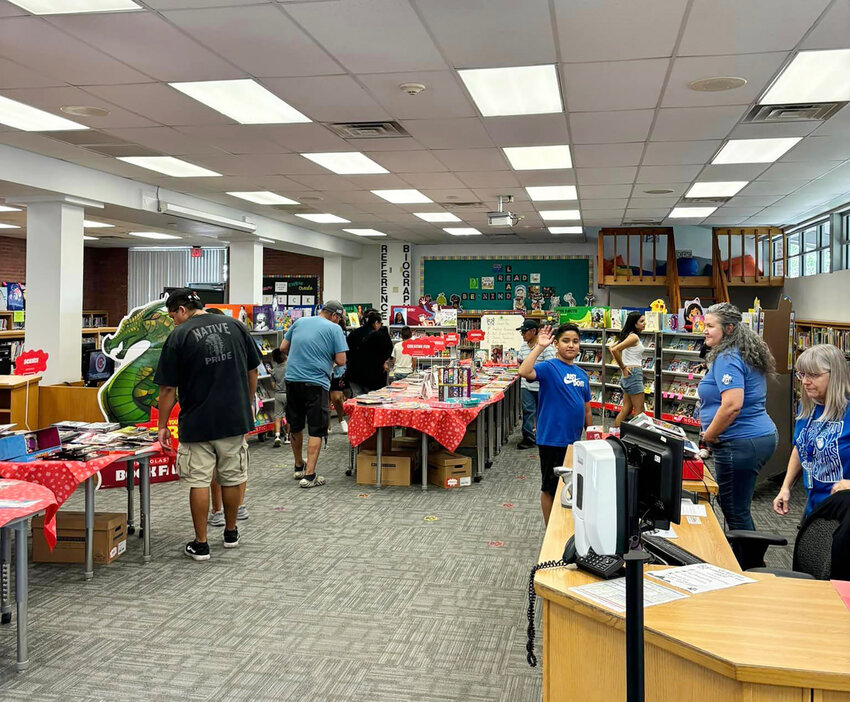 Adults prepare for an April event at Hartford Sylvia Encinas Elementary School. The Chandler Unified School District Governing Board voted May 8 to go with Aramark as a management service for custodial operations in the district.