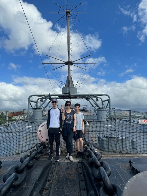 Ryan, left, and Victor Wu stand next to their mother, Pei-yu, at Pearl Harbor in January.