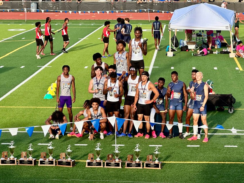 Desert Edge's 4x1000 team stands atop the podium at the Division II meet May 4 at Deer Valley HS. District rival Canyon View, left, was second an Centennial was third.