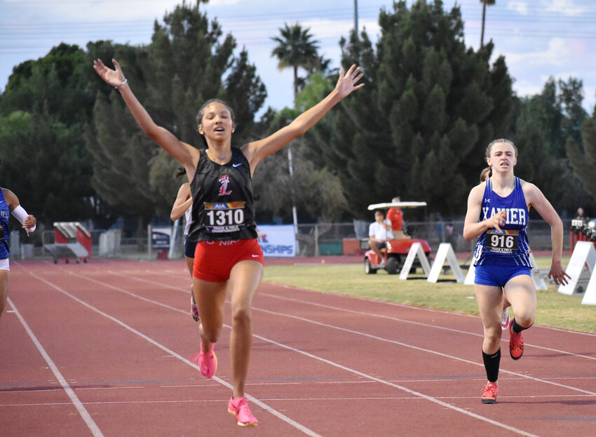 Saylor McMillon of Liberty celebrates as she wins the girls 400 meters during Open Track and Field State Championships on May 11 in Mesa.