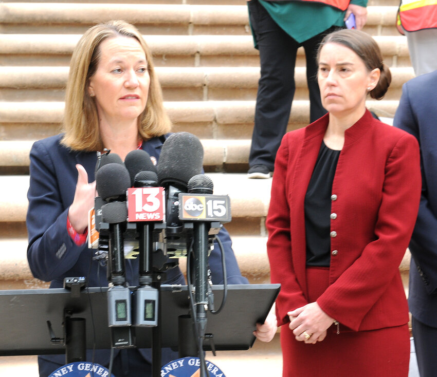 Attorney General Kris Mayes in December following arguments about abortion laws at the Arizona Supreme Court. With her is Pima County Attorney Laura Conover (Capitol Media Services/Howard Fischer)