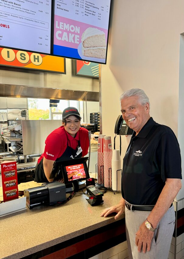 Mayor Skip Hall, right, was one of the first customers at the new Portillo's in Prasada North in Surprise.