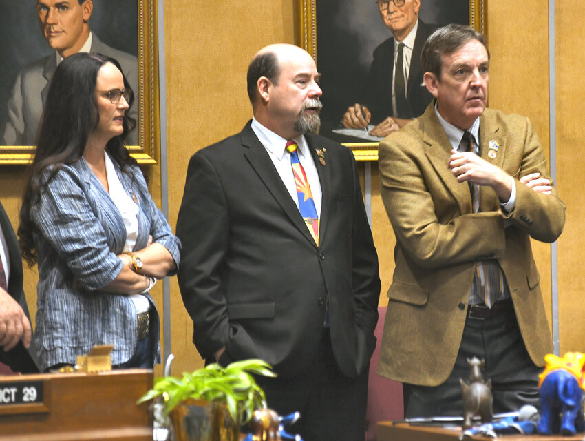 Ken Bennett, right, chats with fellow senators Janae Shamp and David Gowan Tuesday on the Senate floor. (Capitol Media Services photo by Howard Fischer)