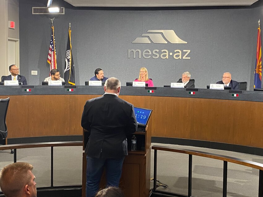 Mesa Council candidates from left are Ron Williams, Zachary Hichez, Francisco Heredia, Julie Spilsbury, Rich Adams, and Tim Meyer. Speaking at the podium is Mike Broomhead.