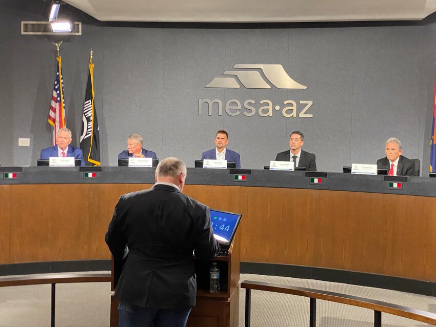 Mesa Mayoral candidates. From left at the back, are Scott Smith, Mark Freeman, Scott Neely, Ryan Winkle and Carey Davis. At the podium is Mike Broomhead from KTAR.