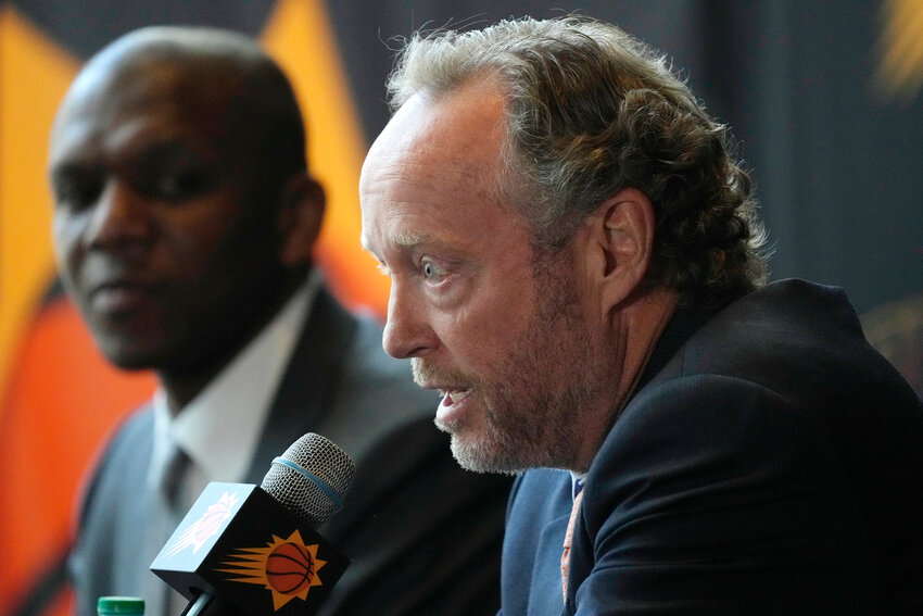 New Phoenix Suns head coach Mike Budenholzer, right, speaks as James Jones, Suns president of basketball operations and general manager, listens during an NBA news conference Friday, May 17, 2024, in Phoenix.