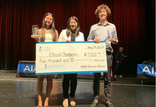 Daleina Egea, left, from Mountain Ridge High School, Faustine Chan from the Better Business Bureau, and Jack Strang from Horizon High School stand for the presentation of the Ethical Champion award to Egea and Strang at the AIA Award Gala May 19 in Surprise.