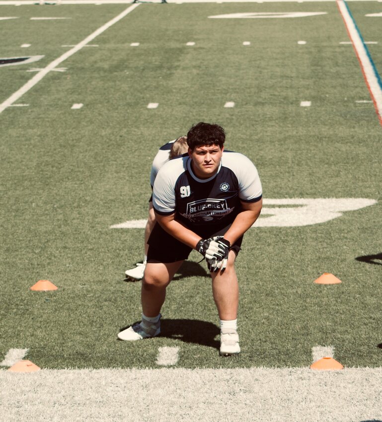 Centennial senior-to-be offensive lineman Camren Durfee stretches before an offseason workout this spring with LMZ Training in Scottsdale. Durfee will miss the first two games of the 2024 season for an unwitting violation of the NIL rule in the Arizona Interscholastic Association bylaws.
