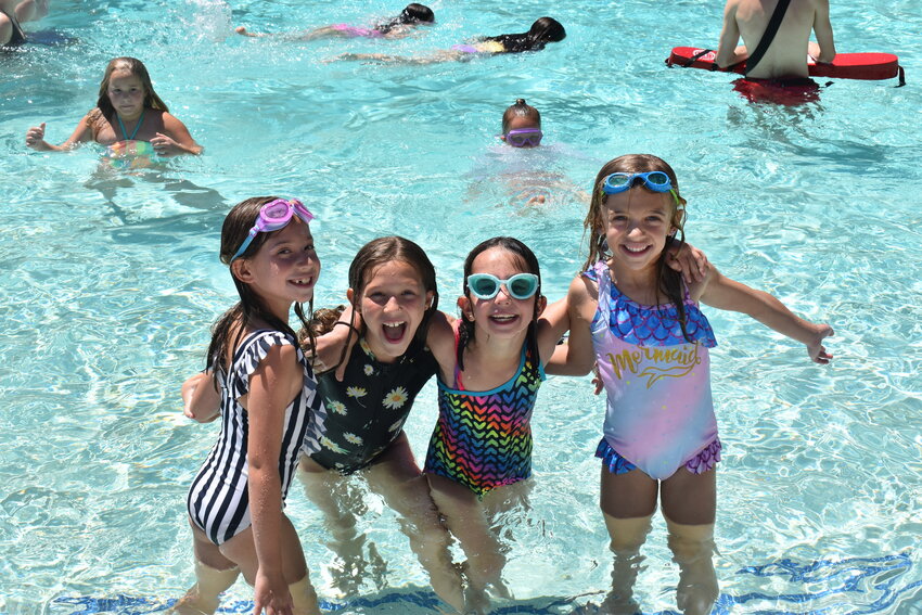 From left, Isla Belfasky, Morgan Granger, Haylee Perilstein and Lila Kaplan enjoy pool time at camp. (Independent Newsmedia/George Zeliff)