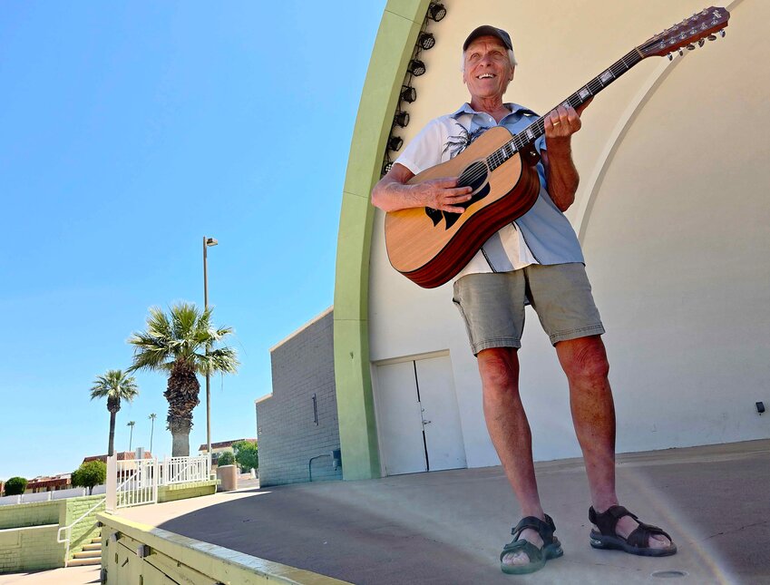 Larry Kubiayk stands on stage at the Sun Bowl in Sun City, one of many West Valley venues he has played around town.