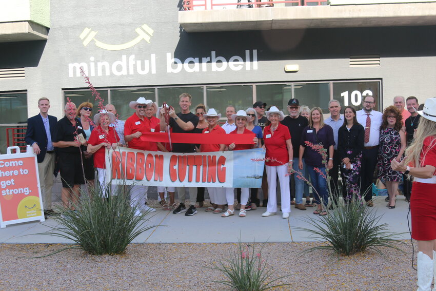 Owner of Mindful Barbell Jon Speakman gets ready to cut the ribbon at a recent Fountain Hills Chamber of Commerce ribbon cutting ceremony. Mindful Barbell offers training sessions based on five foundational pillars: functional strength training, high-intensity intervals, restorative stretching, mindfulness activities and balance exercises. For more information, visit mindfulbarbell.com, call 512-771-7576 or stop inside at 16845 E. Avenue of the Fountains, Suite 102.