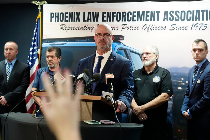 Darrell Kriplean, president of the Phoenix Law Enforcement Association that represents about 2,200 Phoenix officers, takes a question after the release of a Department of Justice report on the Phoenix Police department during a news conference Thursday, June 13 in Phoenix. (The Associated Press/Ross D. Franklin)