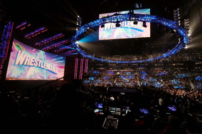 A WrestleMania sign hangs over the crowd during a WWE event March 6, 2023, in Boston.