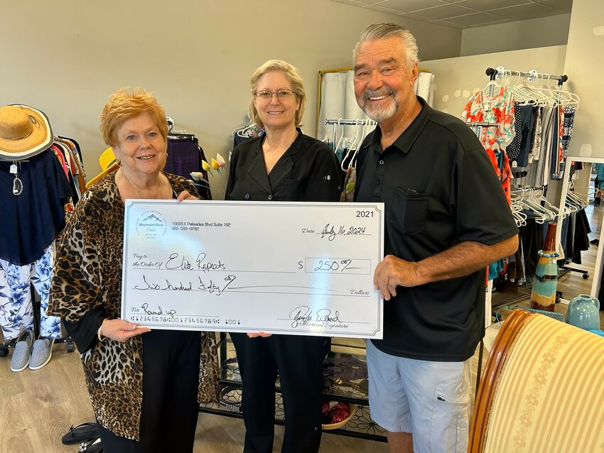 Elite Repeat, the resale boutique located at Plaza Fountainside, recently donated $250 to the Extended Hands Food Bank. Store Owner Debbie Olson (left) partnered with Jennifer Ward (center) of Mountain View Kitchen who ran a &ldquo;round up&rdquo; project for Elite Repeat. Extended Hands Executive Director David Iverson (right) blessed the store with a prayer of thanks.