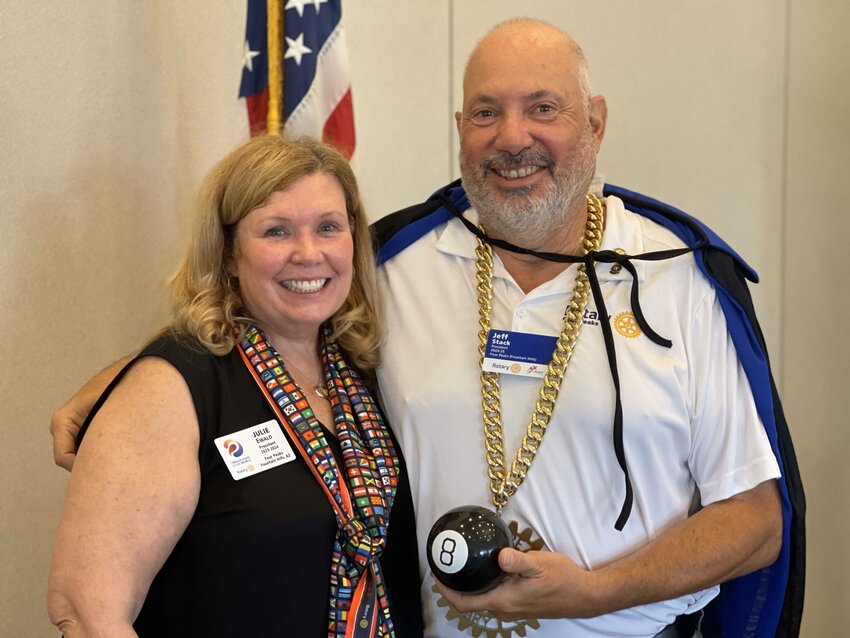 Four Peaks Rotary President Julie Ewald (left) concluded her year of service to the club and welcomed incoming president Jeff Stack (right) at the club&rsquo;s regularly scheduled meeting Thursday, June 27. Ewald honored Stack as the Rotarian of the Month and bestowed him with the P.A.R.T.Y. gold chain as well as a magic cape to fully embrace the 2023-25 Magic of Rotary theme.