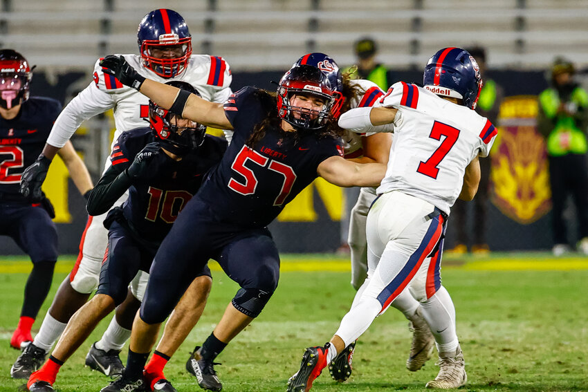 Liberty sophomore defensive end/defensive tackle Paz St. John lunges while getting blocked in an attempt to sack Centennial sophomore Kainan Manna during the Open Division title game Dec. 2, 2023 at Mountain America Stadium in Tempe. St. John has received multiple Division I offers in the offseason.