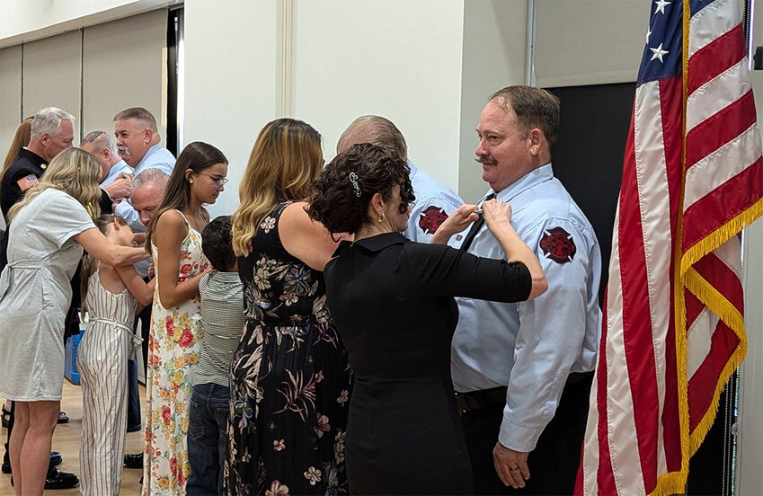 Florence Fire &amp; Medical Department members take part in a pinning ceremony with their families at a July 12 awards ceremony.