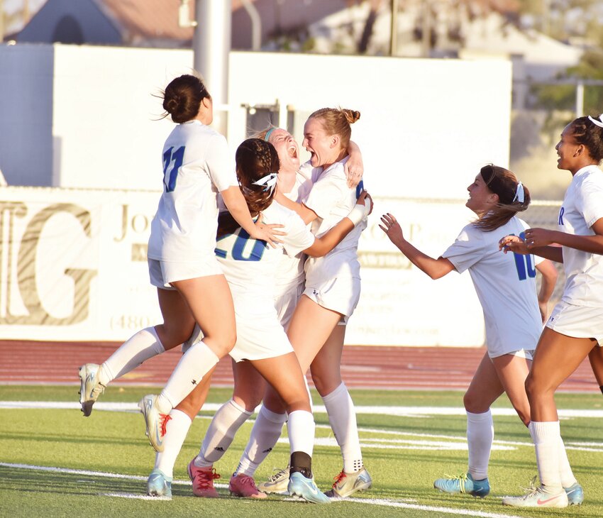 Xavier College Prep senior Lainey Swanson, center, screams out as she&rsquo;s hugged by her teammates after she scored what turned out to be the match-winning goal of the March 1 Open Division championship match. It's the fifth straight year Xavier has ended the season by winning a state title.