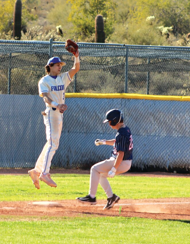 Fountain Hills senior Lucas Grieco takes flight to pull down the throw to third base, but not in time for the out during a March 18 home game against Scottsdale Christian.